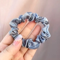 Premium silver grey satin scrunchie hair tie with elegant silk texture and soft pleats - Gray