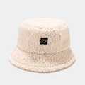Close-up of fluffy cream sherpa bucket hat with a stitched smiley face patch - M (56-58cm) / Beige with Black Label