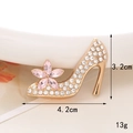 Macro view of gold high heel charm with clear rhinestones and pink crystal flower detail - Gold Base Pink Flower Rhinestone