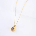 Gold stainless steel necklace with round glass pendant containing colorful crystals - Gold