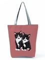 Detail shot of a dusty pink tote bag featuring two cute cartoon cats with grey handles - Cow Cat Print (hl3541) / Dusty Rose