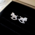 Detailed view of silver horse earrings with sparkling zircons in a black velvet box - Style 8 Pave Zircon Rocking Horse Earrings-Silver Needle (Silver)