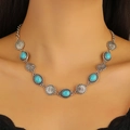 Detail of bohemian necklace featuring turquoise stones and engraved floral metal discs - Vintage Ethnic Style Choker (古银 DZ-452)