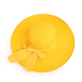 Top-down view of a bright yellow straw sun hat with wide brim and decorative bow - M (56-58cm) / Yellow