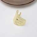 Detail view of the hammered gold texture and irregular wavy edges on the metal hair clip - Irregular Matte Gold