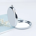 Portable folding round makeup mirror in polished silver metal with daisy card backdrop - Round Mirror Silver