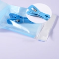 Blue dental sterilization forceps and self-sealing pouch with close-up of tip detail - Sterile Pouch-Blue Triangular Open Clamp