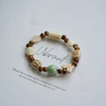 Ceramic beaded bracelet with brown and green leaf, butterfly, and floral charms - 720-03 Jintangchun