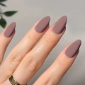 Short matte almond press-on nails in dusty rose pink color on a female hand - Matte Purple Pink
