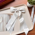 Elegant white satin double-layered bow hair clip with long ribbons on a cream tray - Ivory White 04