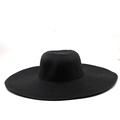 Close-up of the detailed woven texture on the wide brim of a black straw sun hat - M (56-58cm) / Black