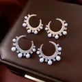 Luxurious C-shaped pearl and zircon earrings in gold and silver plating on leather - Gold + Silver
