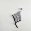 Close-up of baby knit hat featuring elk jacquard patterns and top soft pompom detail - 6-24 Months / Gray