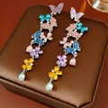 Detailed close-up of vintage butterfly tassel earrings with colorful crystal rhinestones - Silver Earring Post - Colorful
