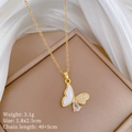 Detail of butterfly pendant necklace with mother-of-pearl, pavé zircon, and gold chain - A427 Titanium Steel Chain Copper Pendant