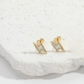 Detail of lightning bolt earrings with gold plating, white enamel, and pavé set zircons - Lightning Stud Earrings / White Lightning