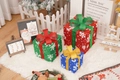 Three Christmas gift boxes in red, green and blue with snowflake patterns and bows - Three-Color White Snowflake Christmas Gift Box