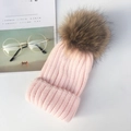 Schicke rosa Strickmütze mit großem braunem Kunstpelzbommel und Rippenstruktur - Kindergröße (49-55cm) 2-10J / Rosa