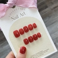 Glossy maple red press-on nails displayed on a white textured card with a pink bow - Large (L) / Tomato Maple Red