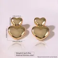 Polished stainless steel double heart stud earrings in shiny gold finish, weight 8.3g - Stainless Steel Layered Double Heart