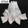 Detail of white bridal mesh gloves with large satin bow, pearls, and rhinestones - White Mesh Large Bowknot Pearl (ST060)