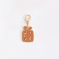 Gift box charm in gold finish with brown enamel and colorful star patterns - Bread