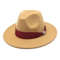 Detail of camel wool fedora hat with red ribbon band and rhinestone buckle accent - Camel