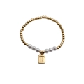 Elastic beaded bracelet with gold metal spheres, white pearls, and a gold letter T pendant - Letter T