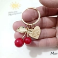 Golden cherry leaf charm keychain with red pendants and a heart shaped brand tag - Red Cherry Engraved Heart Plate Buckle (Cherry T)