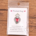 Pocket Hug heart charm in vintage silver and red enamel on an English greeting card - Vintage Silver Heart Pendant