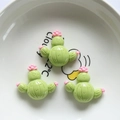 Three green resin cactus figurines with pink flowers for DIY crafts and accessories - Cactus