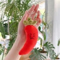 Close-up of cute red chili plush keychain with angry expression and metal ring - Chili Style with Chain