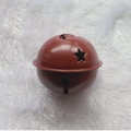 Red 5cm metal Christmas bell with star cutouts on white faux fur background - Star Painted Wine Red