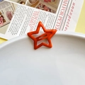 Vibrant orange star-shaped hollow metal hair clip with a smooth glossy finish for women - Orange