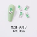 Detalle de adorno de uñas mariposa ojo de gato verde menta 6x10mm con base plateada - Estilo de Marco Plateado Con Combinación de Piedras Preciosas y Lazo (9818)