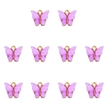 Close-up of ten purple acrylic butterfly pendants for DIY jewelry making on white background - Purple