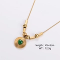 Detail of gold necklace with green heart cat-eye stone pendant and measurement labels - Radial Textured Heart Medallion