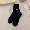 Eleganti calze nere con delicato ricamo floreale e raffinati bordi a volant - Taglia unica / Righe Verticali / Nero