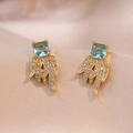 Elegant gold heart earrings with light blue square zircon stones and white crystal wing details - Light Blue Square Wing Style (E0526)