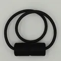Minimalist black magnetic curtain tieback with textured fiber woven cylindrical buckles - Black
