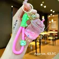 Star-shaped liquid sand keychain with pink floral petals and a green silicone strap - Cat Paw Strap Pink Luminous Dried Flower Iceberg Cup
