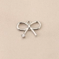 Detailed view of silver bow-shaped jewelry pendant with sparkling zircon accent - Single Stone End Bow (PJ0129-2#) / Silver