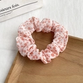 Detail of light pink floral scrunchie with orange polka dots on a wooden tray - 6# Light Pink Orange Polka Dot