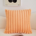 Orange long plush pillow cover with vertical stripes on a modern minimalist sofa - Orange