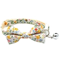 Close-up of floral pet collar with fabric bowtie, silver bell, and plastic safety buckle - Bowknot Style / Yellow Floral