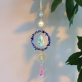 Detail of crystal suncatcher with golden sun, moon rings and blue gemstone beads - Lapis Lazuli