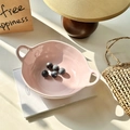 Pink ceramic bowl with double handles for yogurt or salad on a lifestyle table setting - Pink
