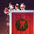Cartoon wooden Christmas door frame decor featuring Santa and reindeer on a door corner - Left A Style