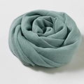 Rolled sage green cotton linen scarf in rose shape with soft woven texture - Bean Green