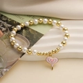 Bracelet avec pendentif sucette cœur rose, perles dorées et perles blanches sur socle - Pendentif Sucette Coeur Rose